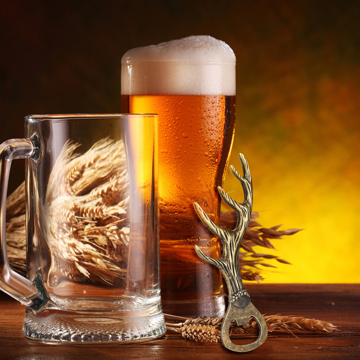 Bronze deer antler bottle opener beside a beer mug