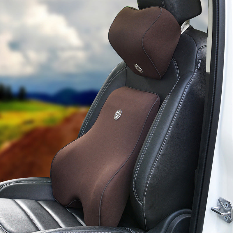 Brown car seat back support and neck pillow installed on a seat