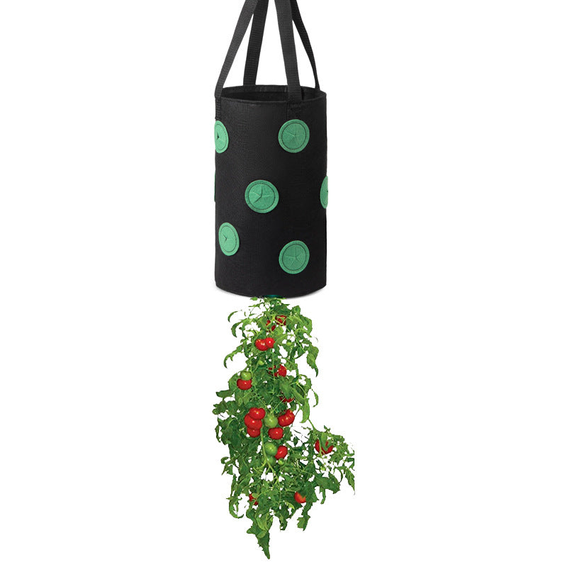 Black hanging grow bag with black handles and green-edged planting holes