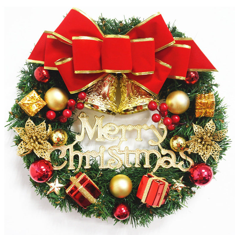 Christmas wreath with a red velvet-look bow, gold bells, red baubles, gift boxes and a gold Merry Christmas sign