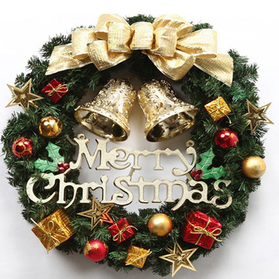 Christmas wreath with a gold bow, two gold bells, stars, gift boxes and a Merry Christmas sign