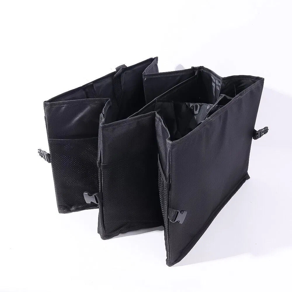 Black trunk organizer folded open with divided sections on a white background