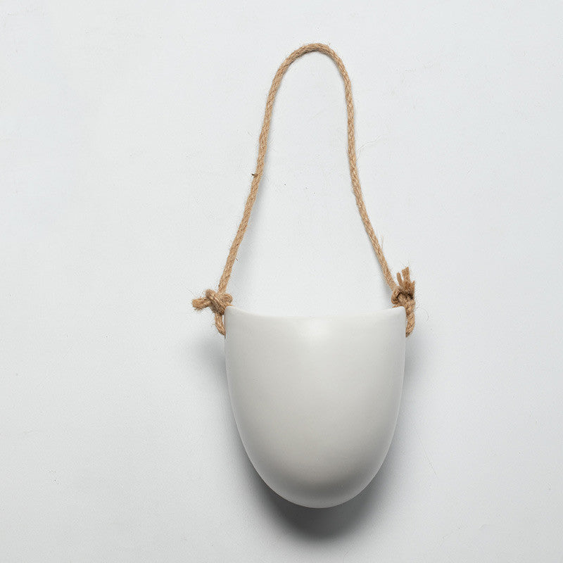 White half ceramic wall planter with rope hanger
