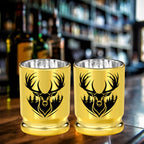 Pair of gold deer head shot glasses on a bar counter