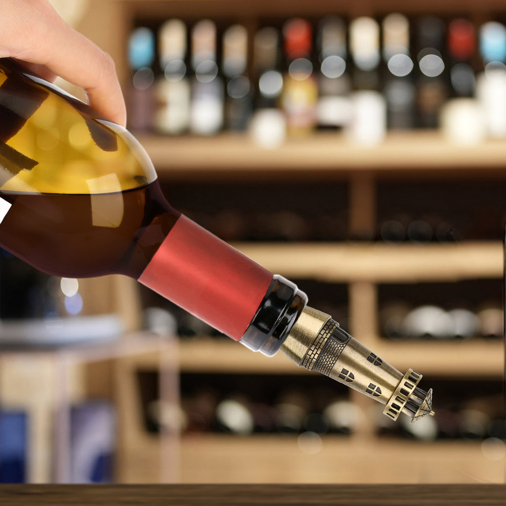 Bronze lighthouse wine stopper fitted on a tilted wine bottle