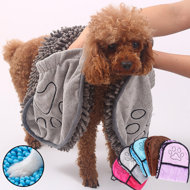 Brown poodle being dried with a grey chenille pet towel