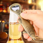 Hand using bronze bass fish bottle opener on a beer bottle