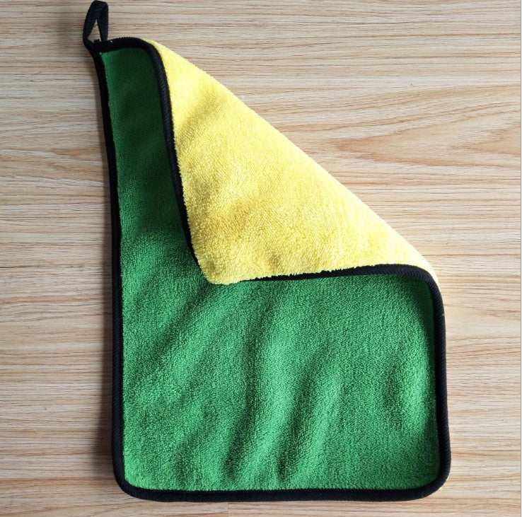 Folded yellow and grey cleaning towels stacked together