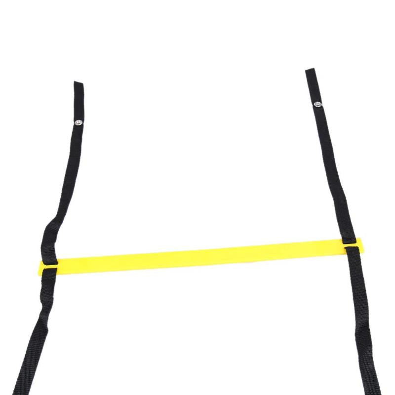 Yellow agility ladder folded beside its carry bag