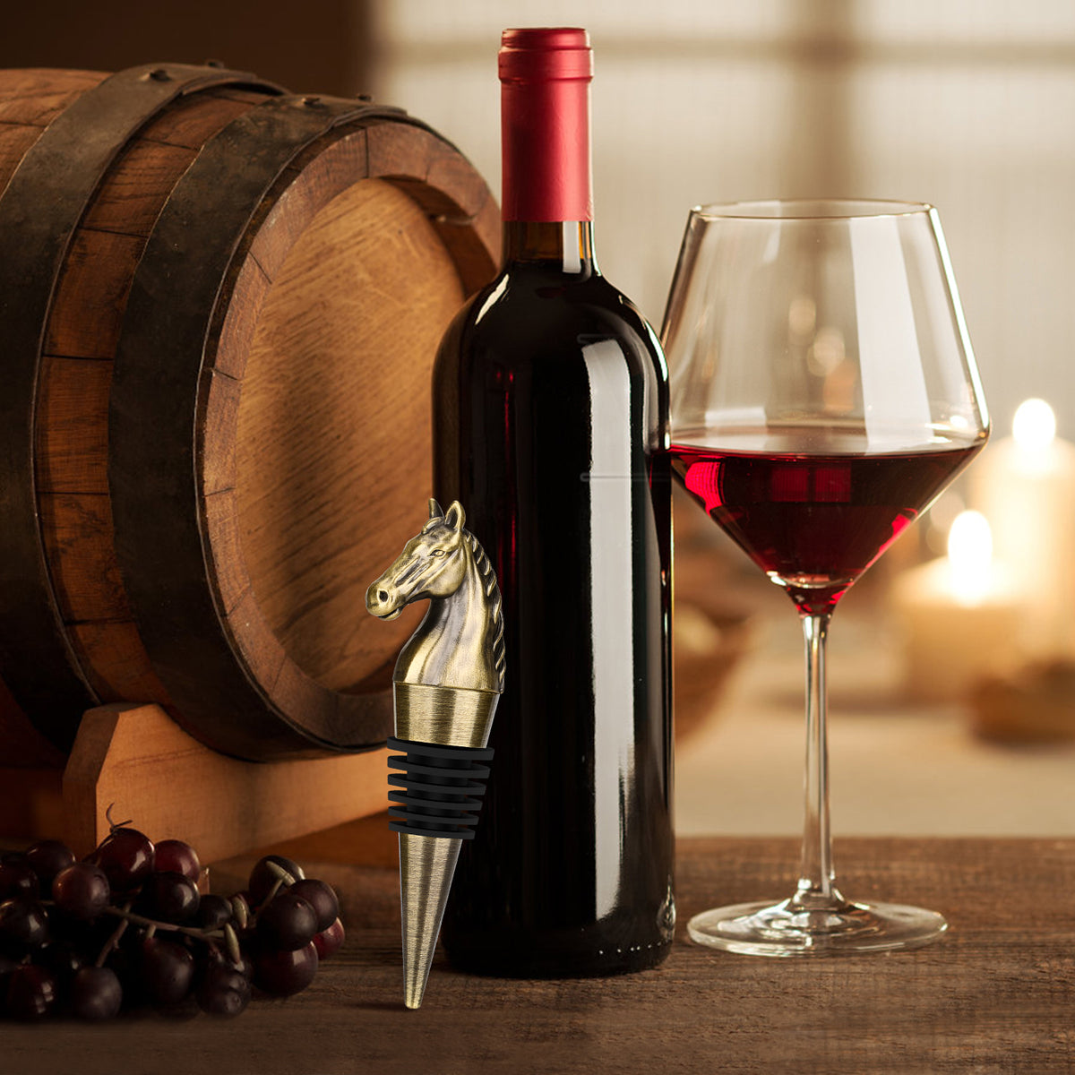 Bronze horse head wine stopper in a bottle beside a glass of red wine
