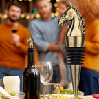 Bronze horse head wine stopper at a dinner party