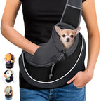 Woman wearing a black pet sling carrier with a small dog looking out of the opening