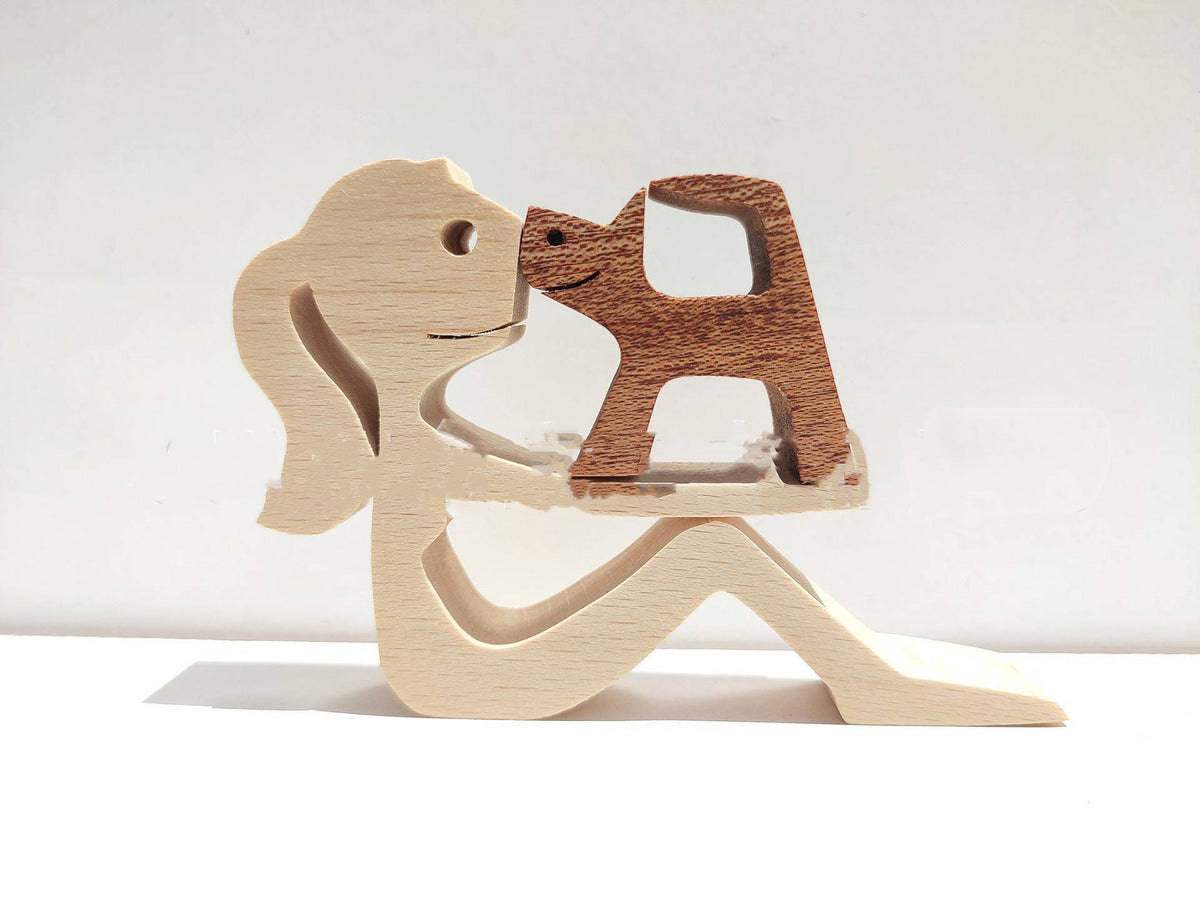 Wooden person and dog figurine, Style 1: seated person facing a small dog, nose to nose