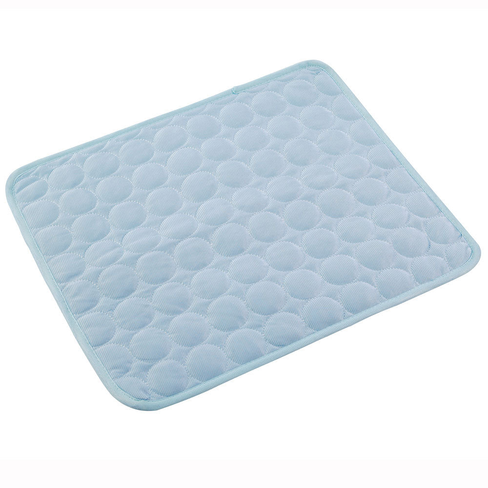 Light blue quilted pet sleeping mat with a circle pattern
