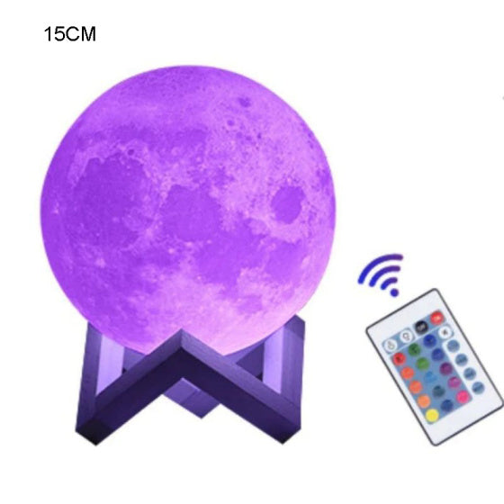 Purple moon lamp on a stand next to its remote control