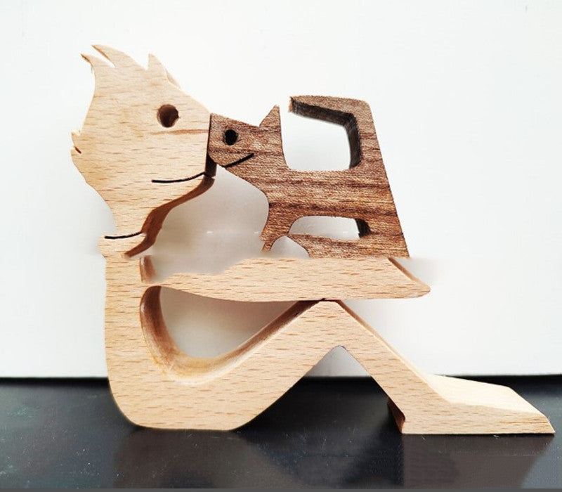 Wooden person and dog figurine, Style 5: seated person embracing a dog