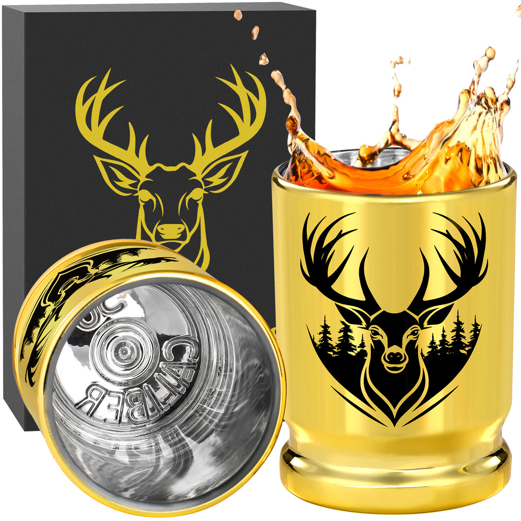 Gold deer head shot glass with whiskey splash and open gift box