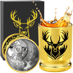 Gold deer head shot glass with whiskey splash and open gift box