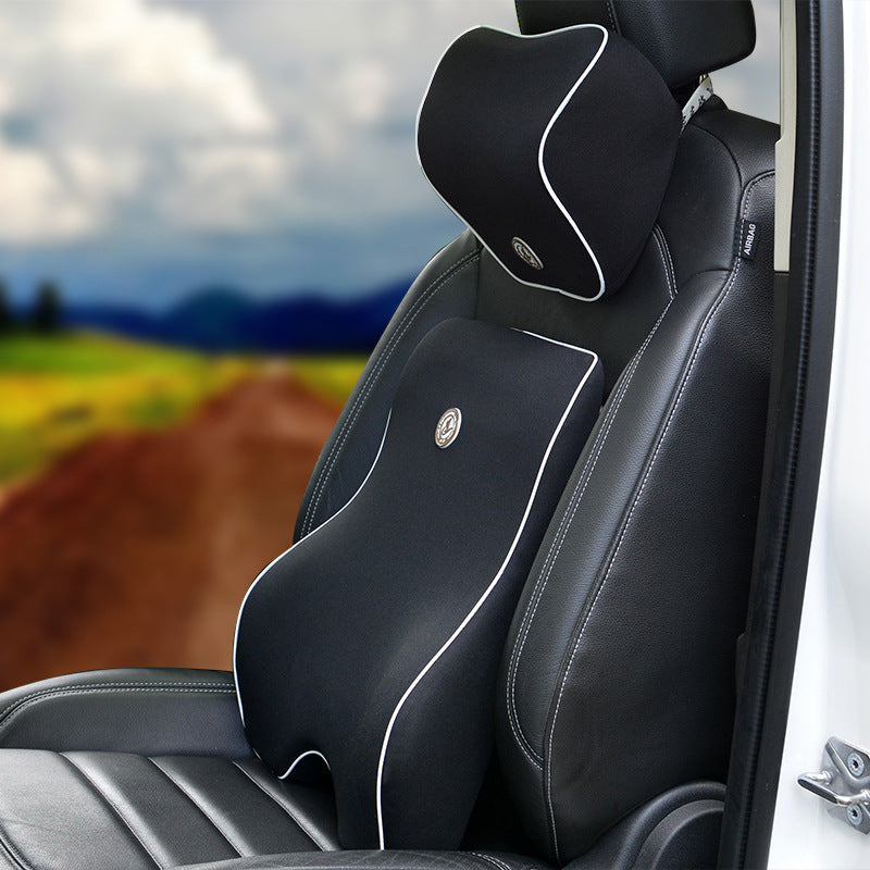 Black car seat back support and neck pillow installed on a seat