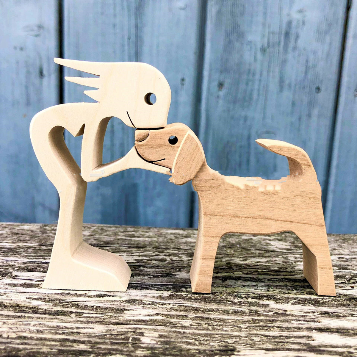 Wooden person and dog figurine, Style 2: person and golden-toned dog head to head