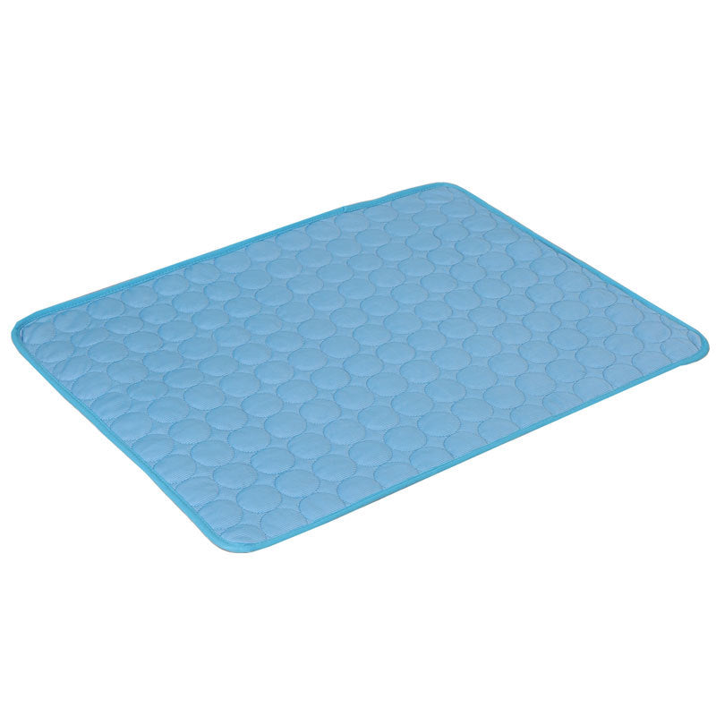 Blue quilted pet sleeping mat with a circle pattern