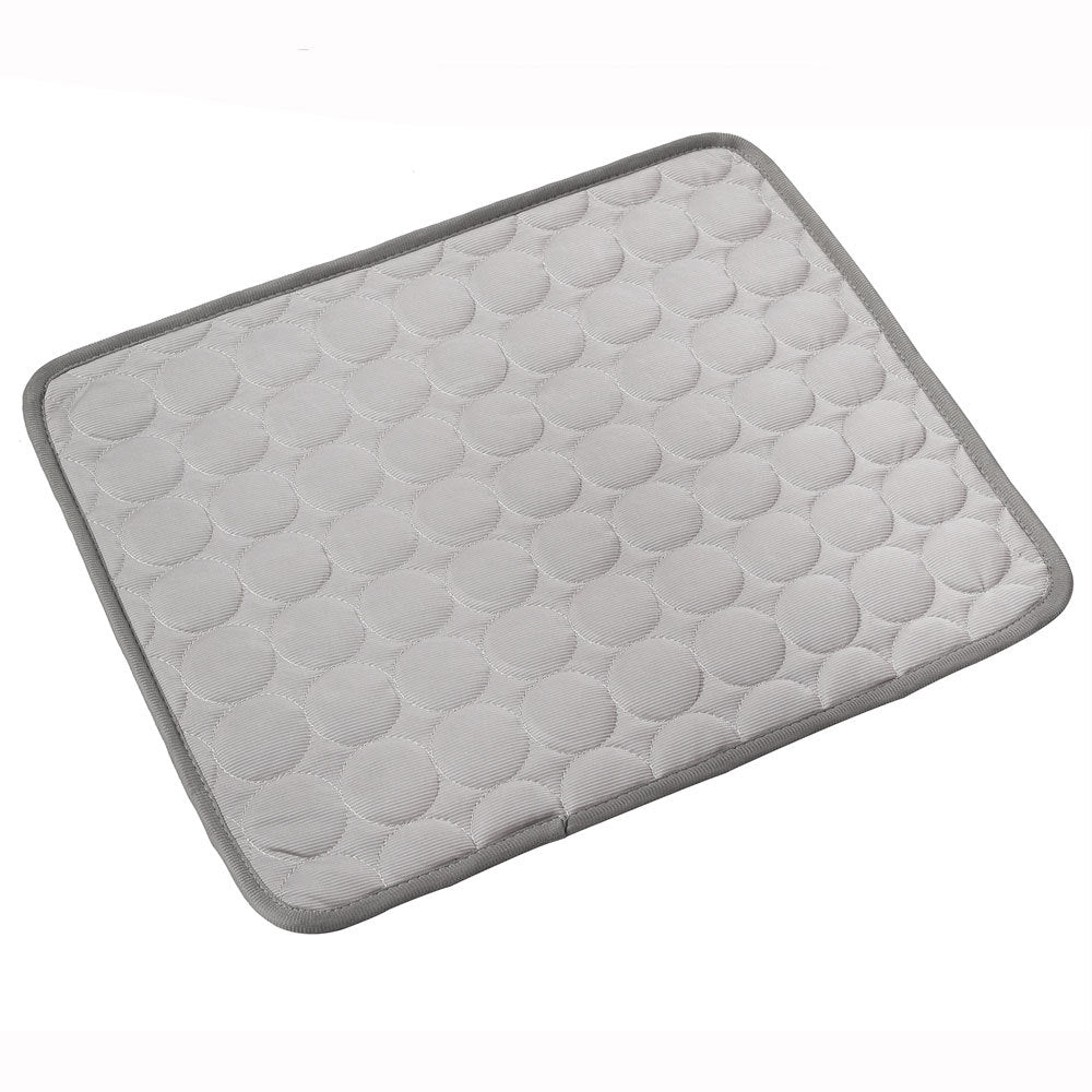 Gray quilted pet sleeping mat with a circle pattern