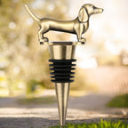 Bronze dachshund wine stopper on an outdoor path