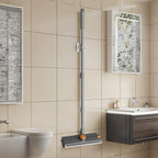 3-in-1 long-handle floor scrub brush in a bathroom
