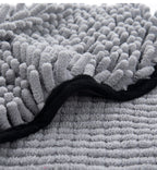 Close-up of grey chenille microfiber texture with black edging