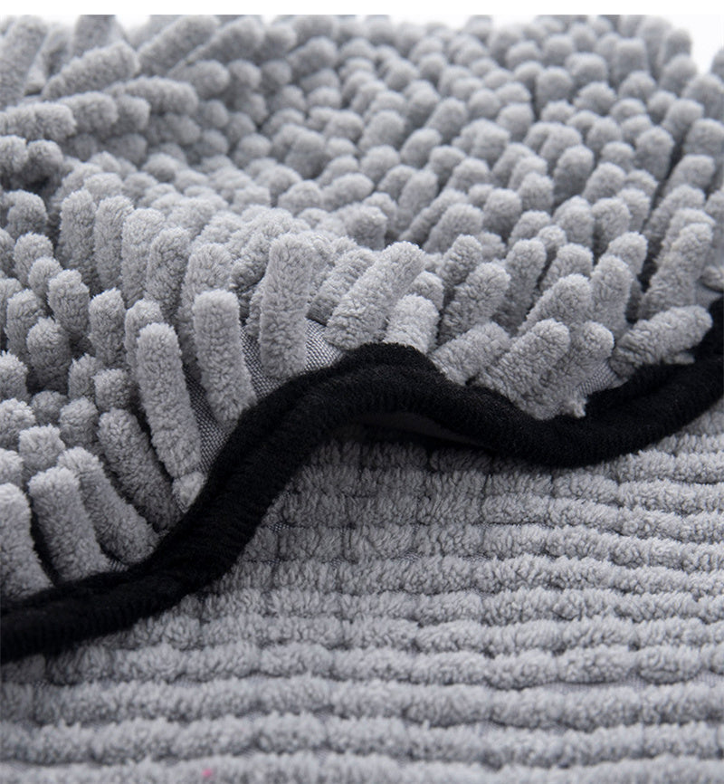 Close-up of grey chenille microfiber texture with black edging