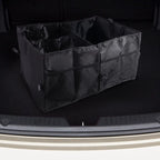Black collapsible organizer sitting in the trunk of a car