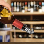 Dark Silver horse head wine stopper fitted on a tilted wine bottle