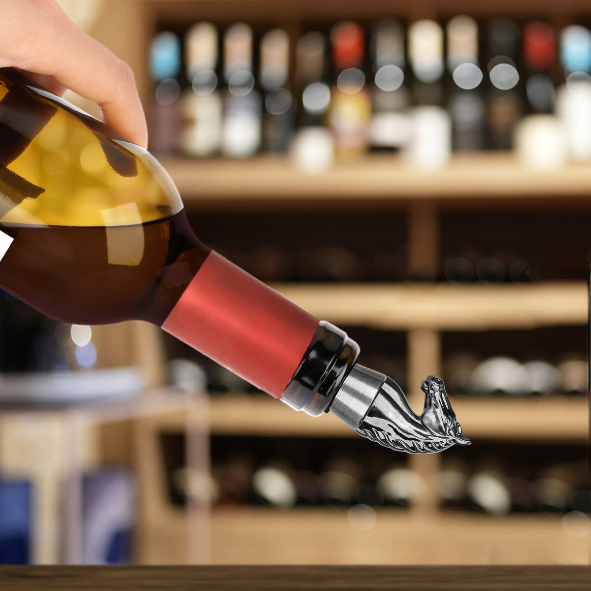 Dark Silver horse head wine stopper fitted on a tilted wine bottle