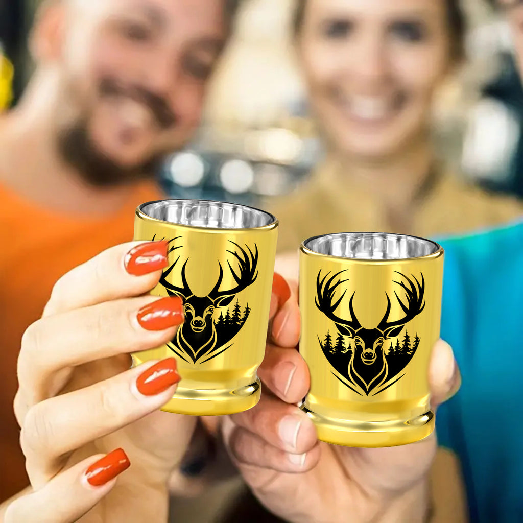Two people toasting with gold deer head shot glasses