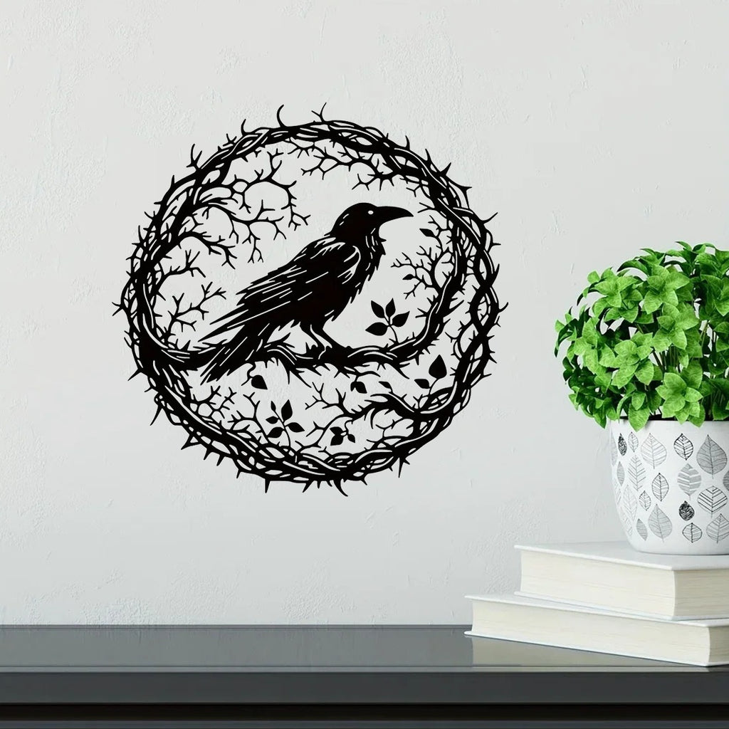 Raven wall art beside a plant