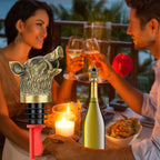 Bronze wild boar head wine pourer on a bottle at a candlelit dinner