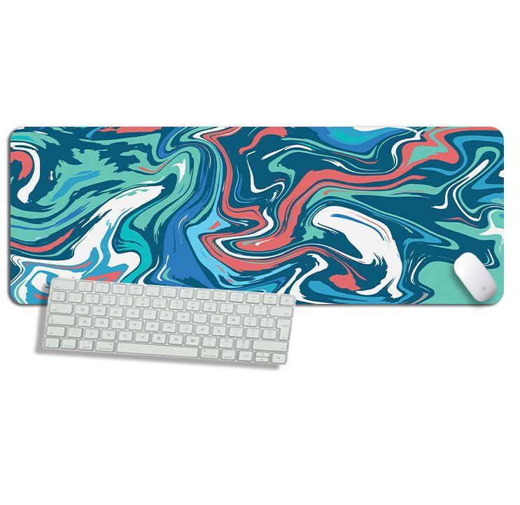 Teal, coral and white marble-swirl desk mat under a keyboard and mouse