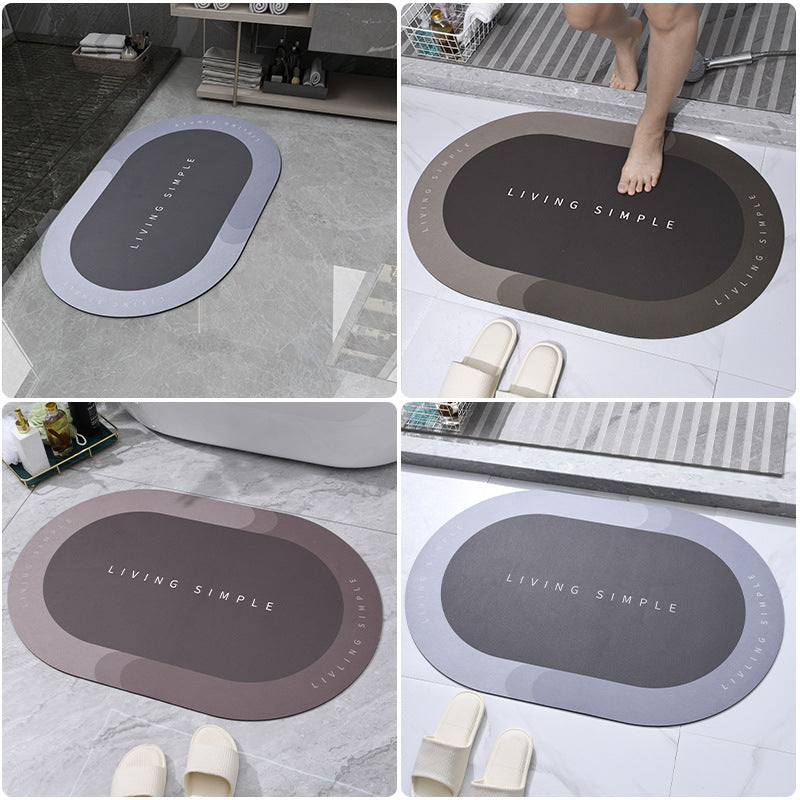 Four oval bath mats shown together in grey, brown, mauve and dark grey